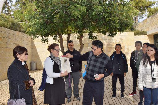 ICEJ Hong Kong National Directors Nancy (far left) and Colin Chow (front, middle) and their group being presented with Certificates of Adoption of Trees in the Avenue of the Righteous at Yad Vashem on 4th December, 2016